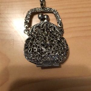 Pursed shaped locket. With matching chain.